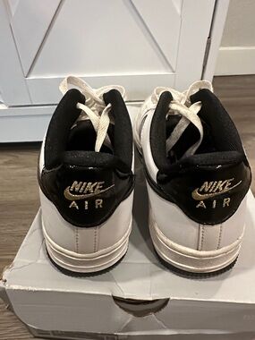 Nike Kids White and Black Sneakers with Gold Embroidered Logo